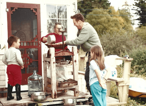 My family cleaning out an old wooden cider press on our back deck in about 1989.