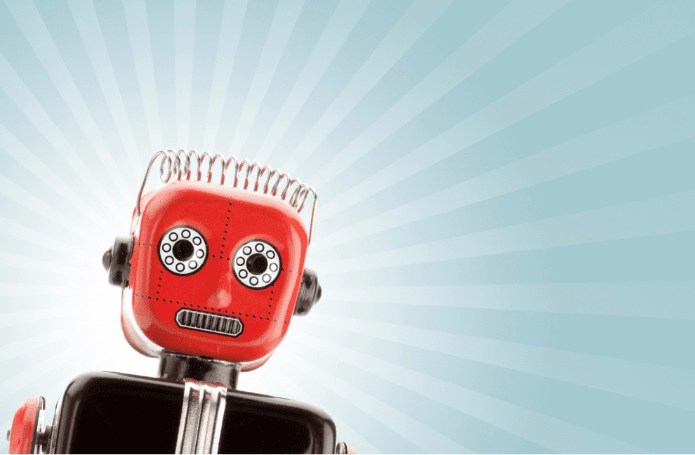 A shiny red robot stares out of the screen. He looks like he's wearing a black suit and white dress shirt.